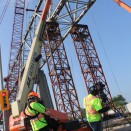 The team films an Iron Worker on a manlift high above Cornwall, Ontario.